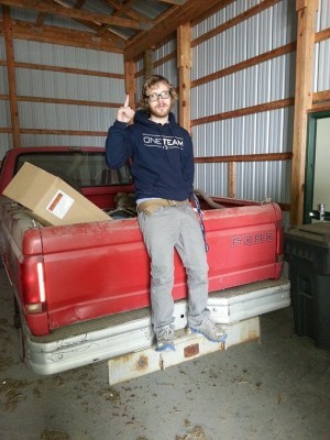 Joseph Marcus poses with his newly acquired Ford F150 pickup truck.
