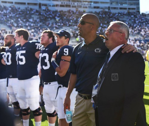 Coach Franklin invited Dr. Bundy to sing the alma mater with the team on the field after the Homecoming game against Northwestern. Photo: Annemarie Mountz.